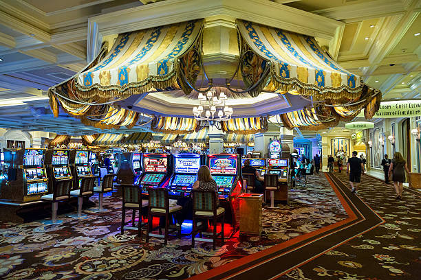 Live casino dealer at roulette table and football match on split screen